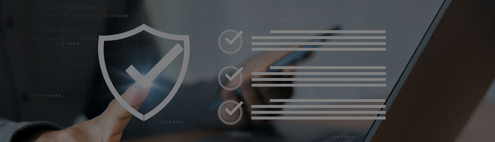Shield with a check mark over a laptop